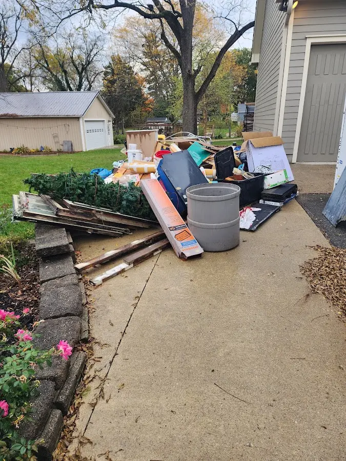Dumpster being loaded with debris for 3 Yard Dumpster Rental in Rolling Hills Estates